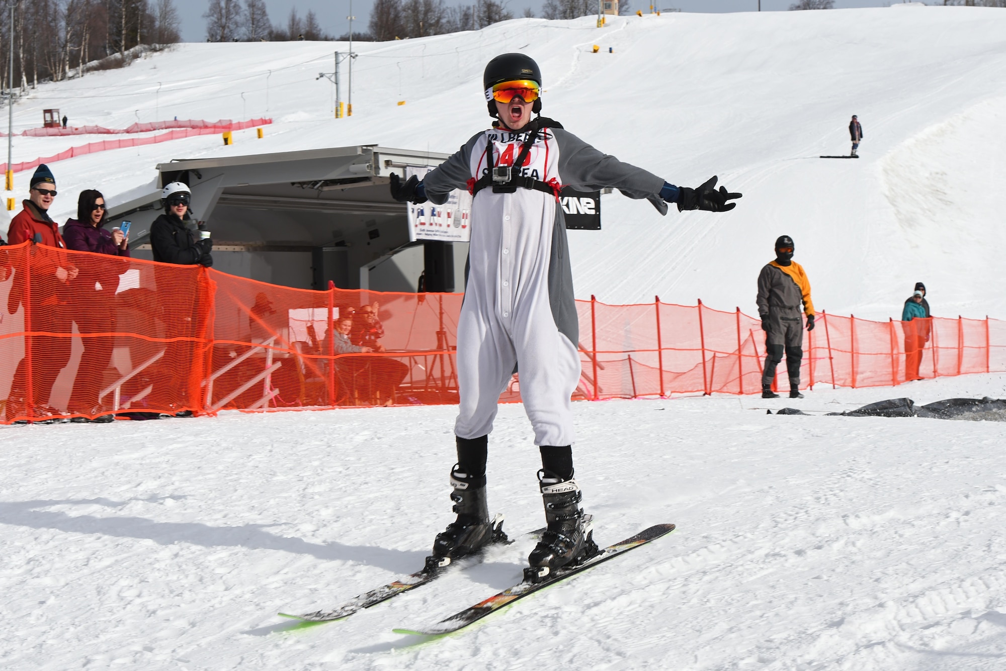Joint Base Elmendorf-Richardson personnel and families participate in the Slush Cup at the Hillberg Ski Area, March 19, 2017. The Slush Cup is an annual event where skiers and snowboarders try to make it across a slush pond without falling. 