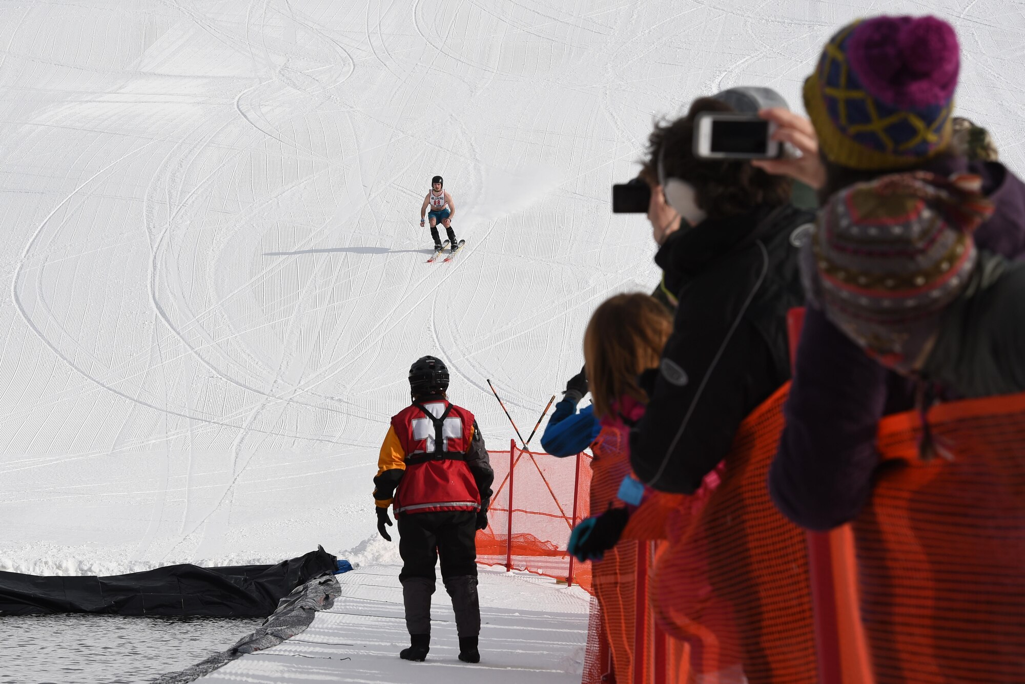 Joint Base Elmendorf-Richardson personnel and families participate in the Slush Cup at the Hillberg Ski Area, March 19, 2017. The Slush Cup is an annual event where skiers and snowboarders try to make it across a slush pond without falling. 