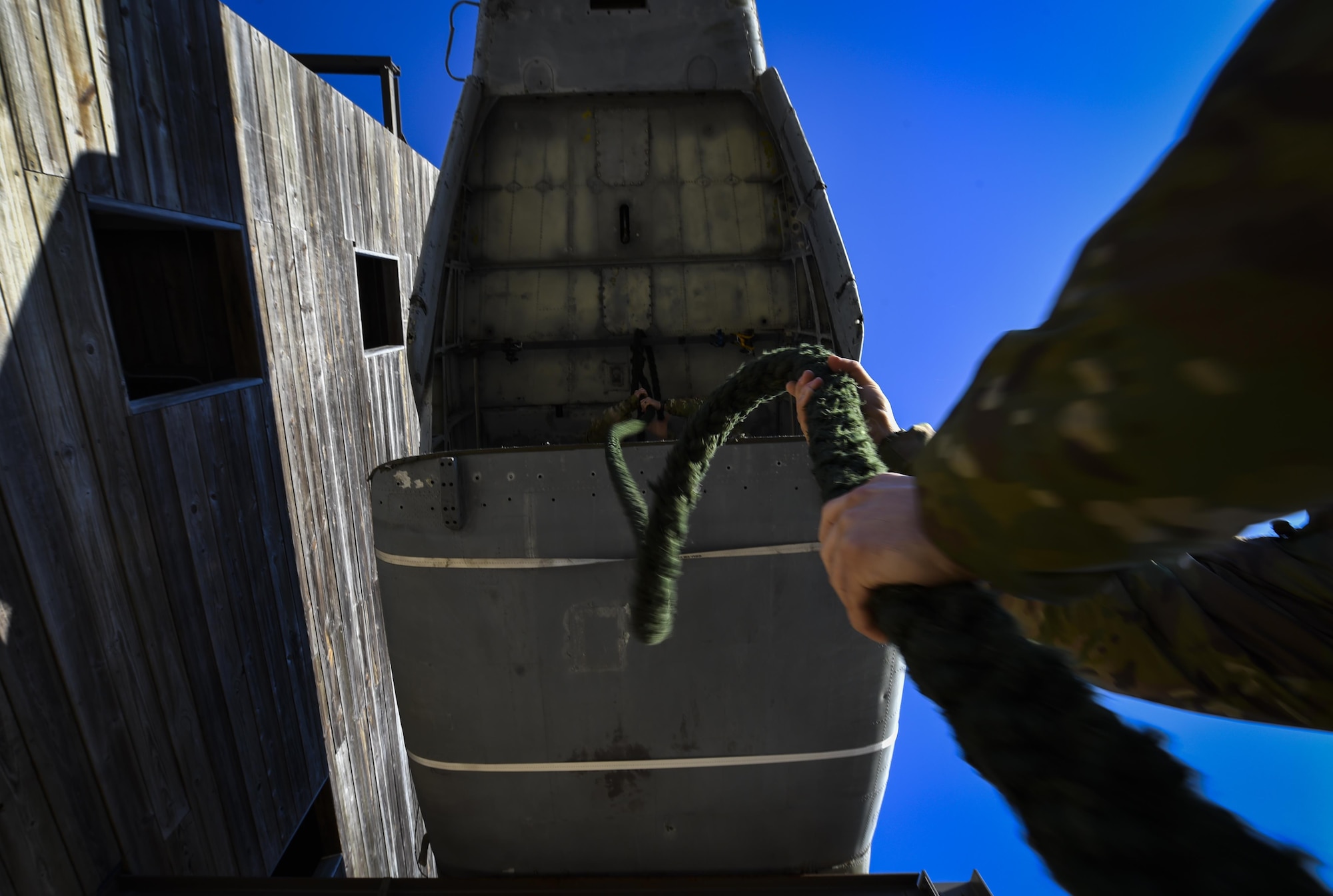 A Soldier with the 1st Battalion, 10th Special Forces Group, holds a rope in preparation for fast-rope training at Hurlburt Field, Fla., March 17, 2017. An instructor with the 1st Special Operations Support Squadron Operational Support Joint Office trained Soldiers on proper fast roping techniques for special operations missions. (U.S. Air Force photo by Airman 1st Class Joseph Pick)