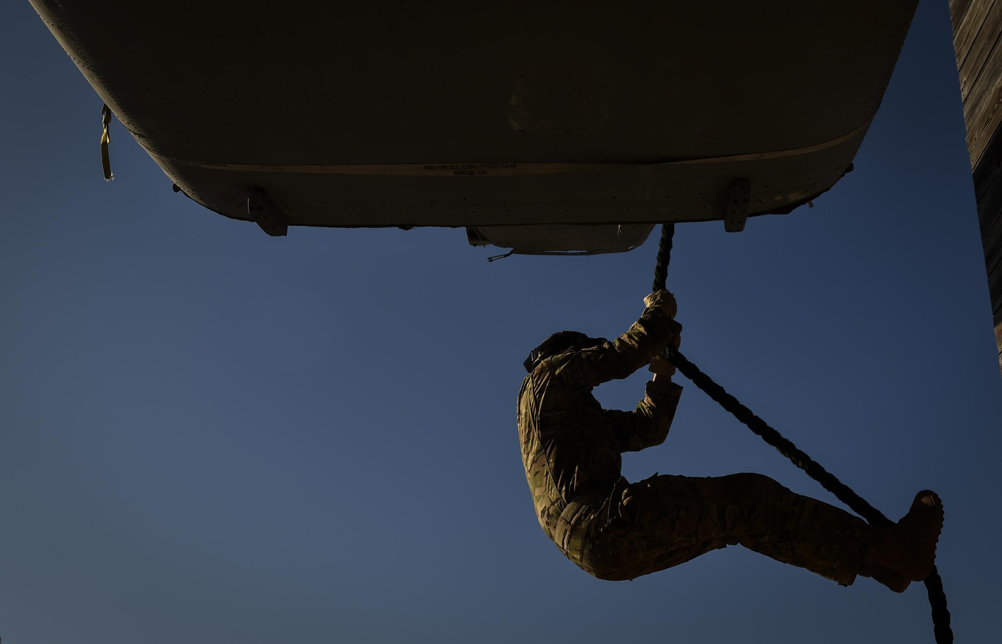 A Soldier with the 1st Battalion, 10th Special Forces Group, fast ropes from a static CV-22 Osprey tiltrotor aircraft frame during training at Hurlburt Field, Fla., March 17, 2017. An instructor with the 1st Special Operations Support Squadron Operational Support Joint Office trained Soldiers on proper fast roping techniques for special operations missions. (U.S. Air Force photo by Airman 1st Class Joseph Pick)