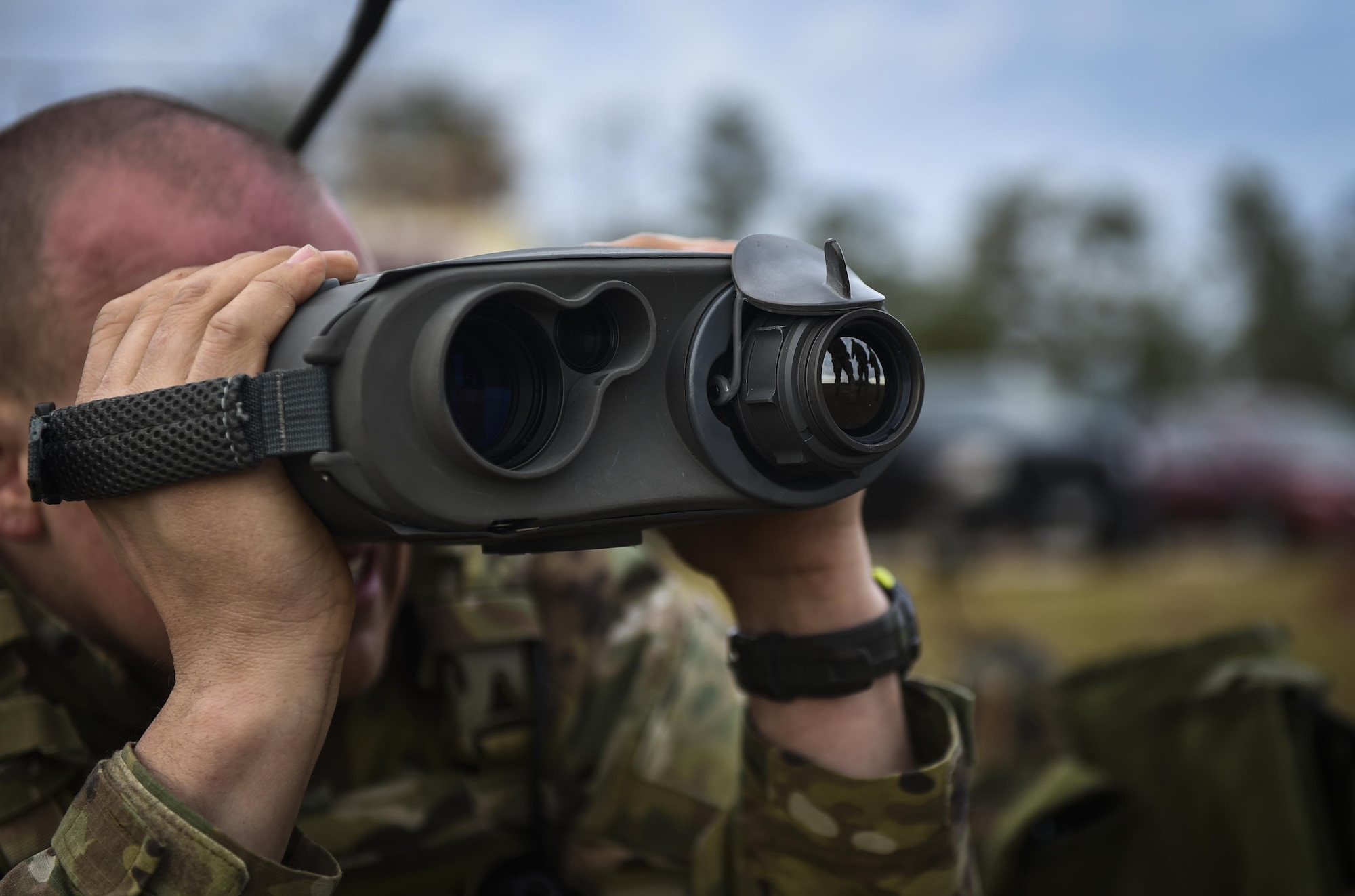 A Soldier with the 1st Battalion, 10th Special Forces Group, uses a laser rangefinder at the Eglin Range, Eglin Air Force Base, Fla., March 17, 2017. Soldiers use the laser rangefinder to identify target location distance, day or night, and with limited visibility such as fog or smoke. (U.S. Air Force photo by Airman 1st Class Joseph Pick)