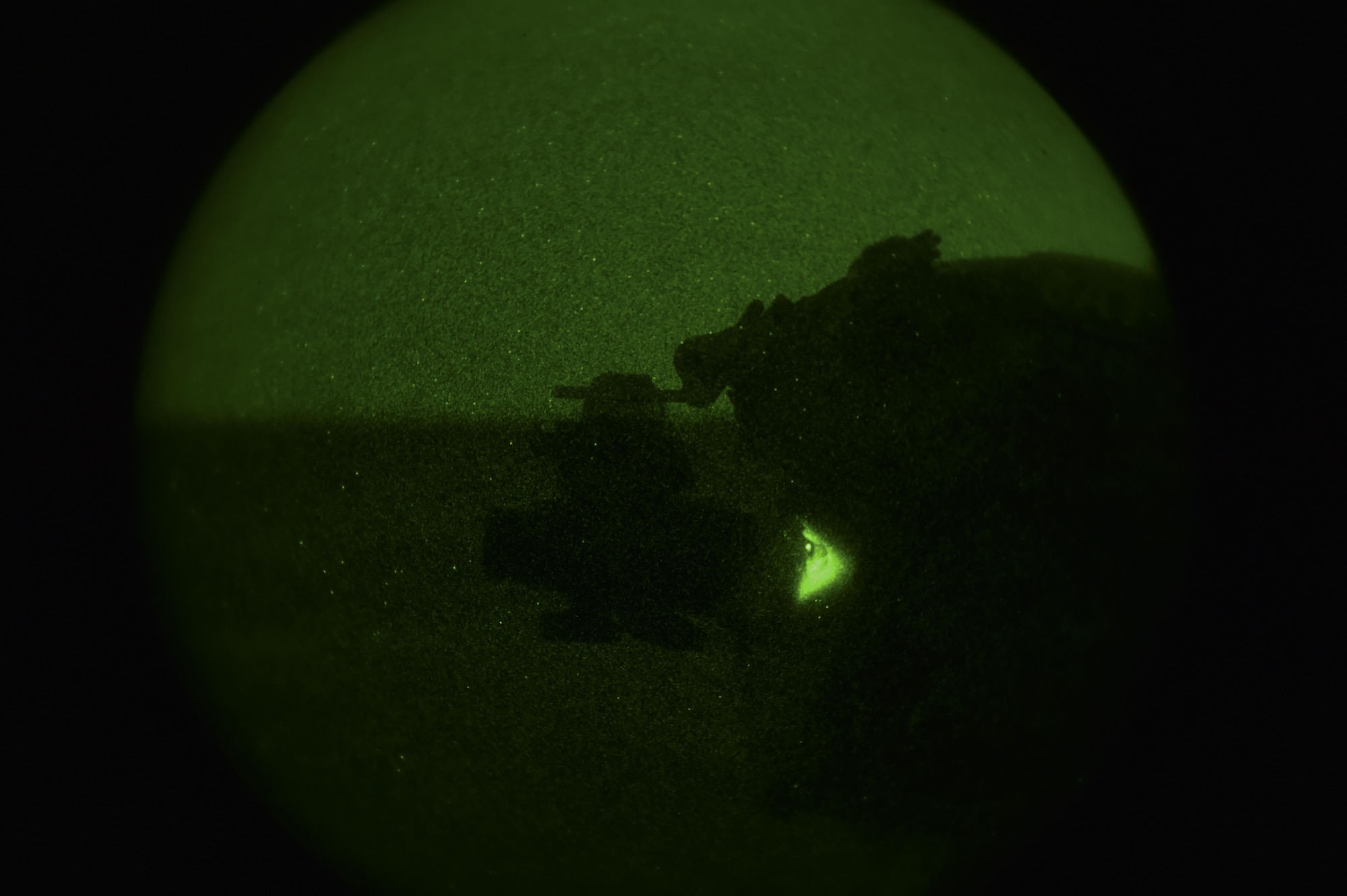 A Soldier with the 1st Battalion, 10th Special Forces Group, uses night vision goggles to participate in call-for-fire training at the Eglin Range, Eglin Air Force Base, Fla., March 17, 2017. The 1st Special Operations Support Squadron Operational Support Joint Office coordinates two-week long training programs for Army, Navy and Marine special operations forces that provides live-fire ranges and familiarizes them with Air Force Special Operations Command aircraft to ensure global readiness. (U.S. Air Force photo by Airman 1st Class Joseph Pick)