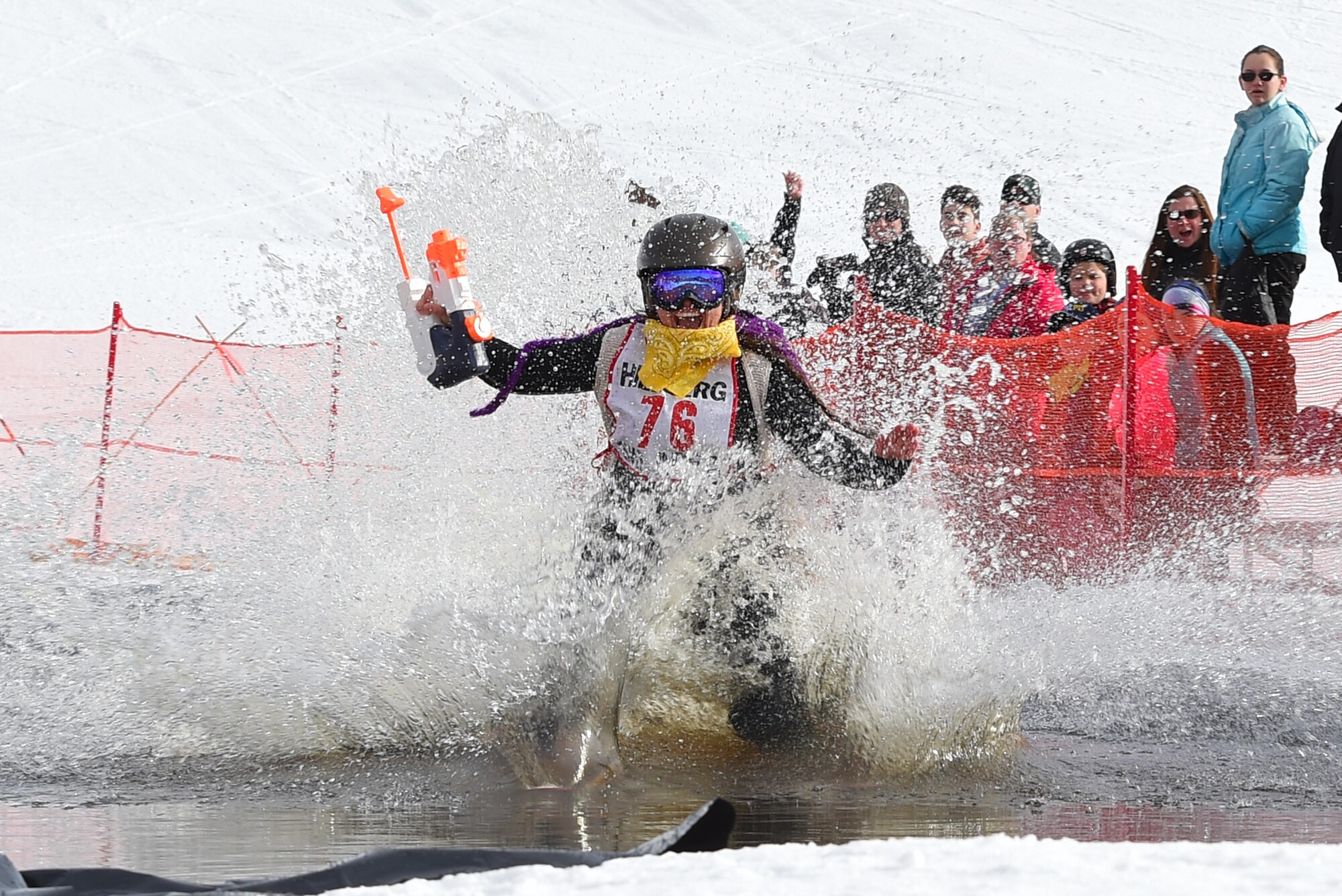 Joint Base Elmendorf-Richardson personnel and families participate in the Slush Cup at the Hillberg Ski Area, March 19, 2017. The Slush Cup is an annual event where skiers and snowboarders try to make it across a slush pond without falling. 