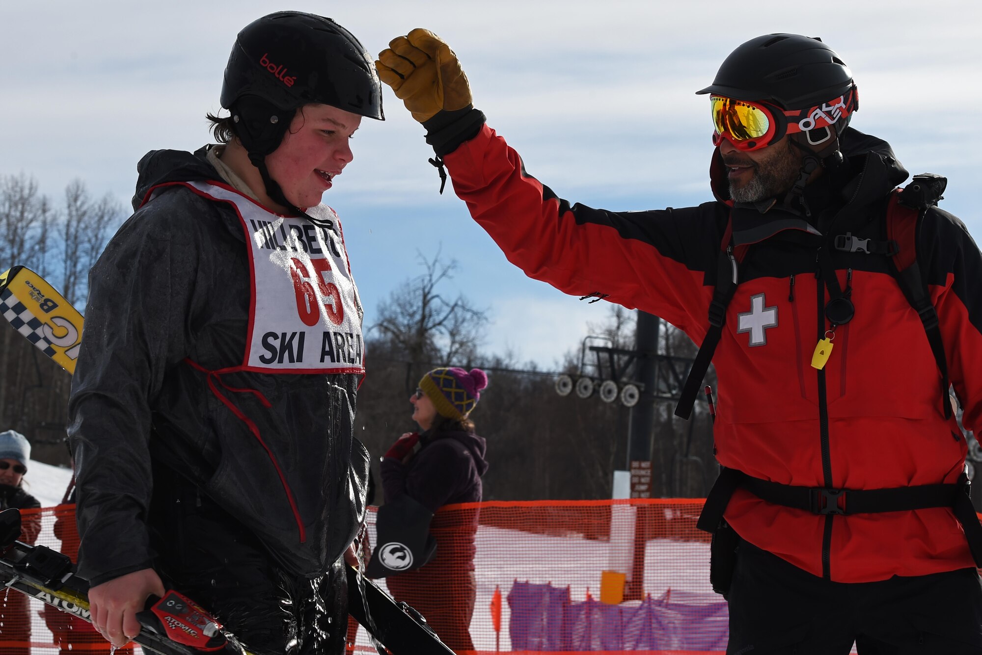 Joint Base Elmendorf-Richardson personnel and families participate in the Slush Cup at the Hillberg Ski Area, March 19, 2017. The Slush Cup is an annual event where skiers and snowboarders try to make it across a slush pond without falling. 