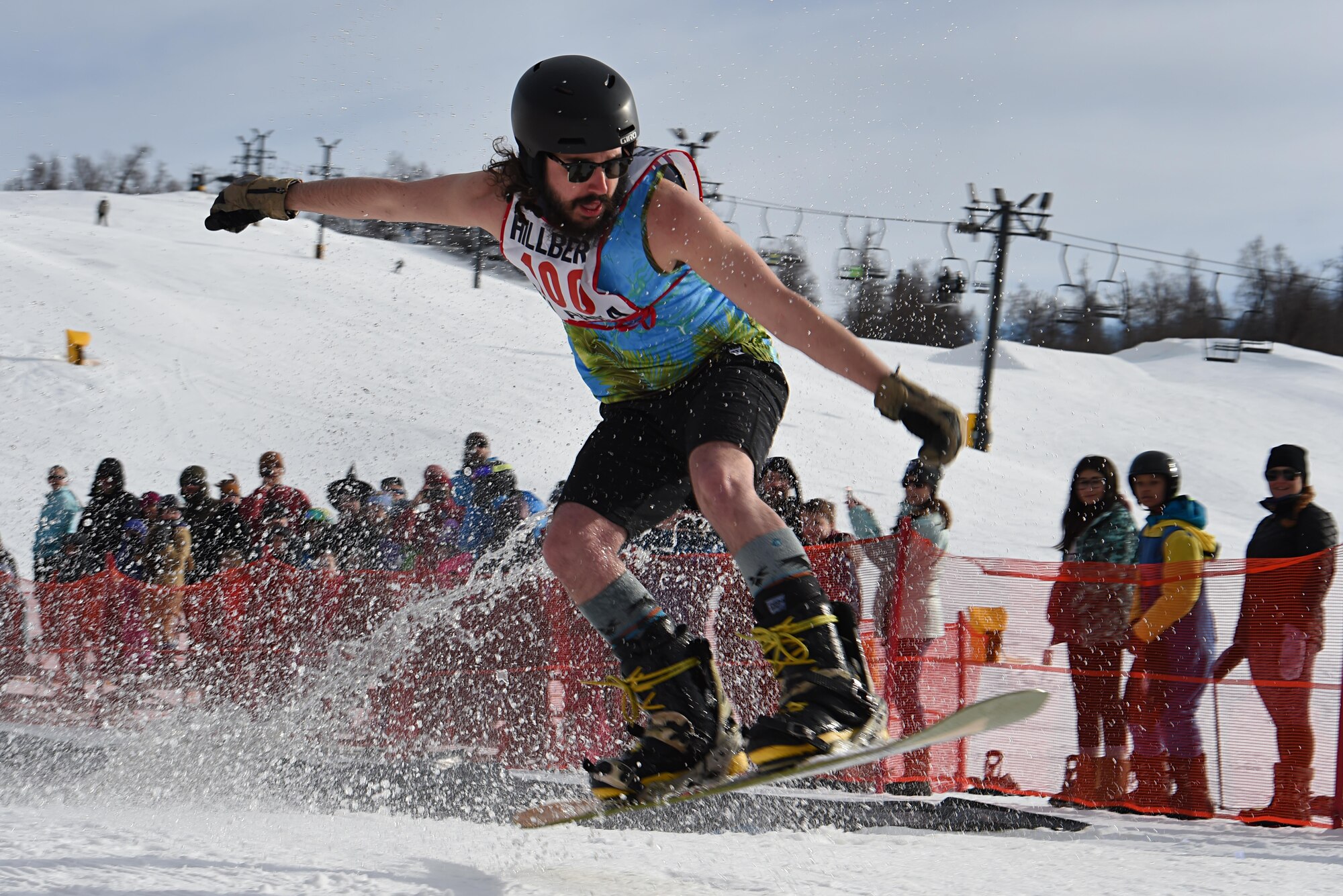 Joint Base Elmendorf-Richardson personnel and families participate in the Slush Cup at the Hillberg Ski Area, March 19, 2017. The Slush Cup is an annual event where skiers and snowboarders try to make it across a slush pond without falling. 