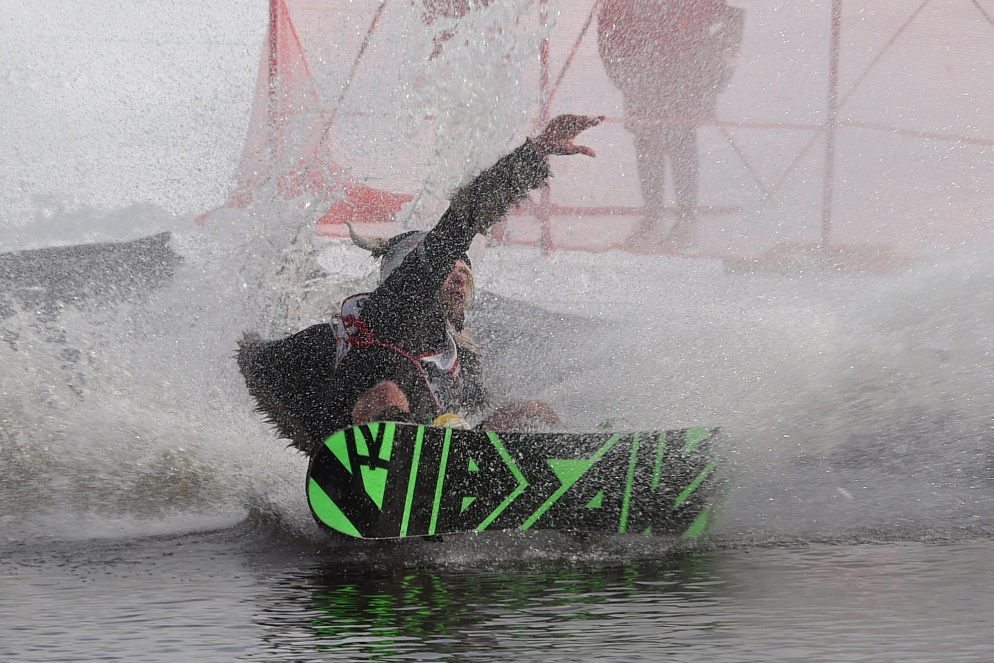 Joint Base Elmendorf-Richardson personnel and families participate in the Slush Cup at the Hillberg Ski Area, March 19, 2017. The Slush Cup is an annual event where skiers and snowboarders try to make it across a slush pond without falling. 