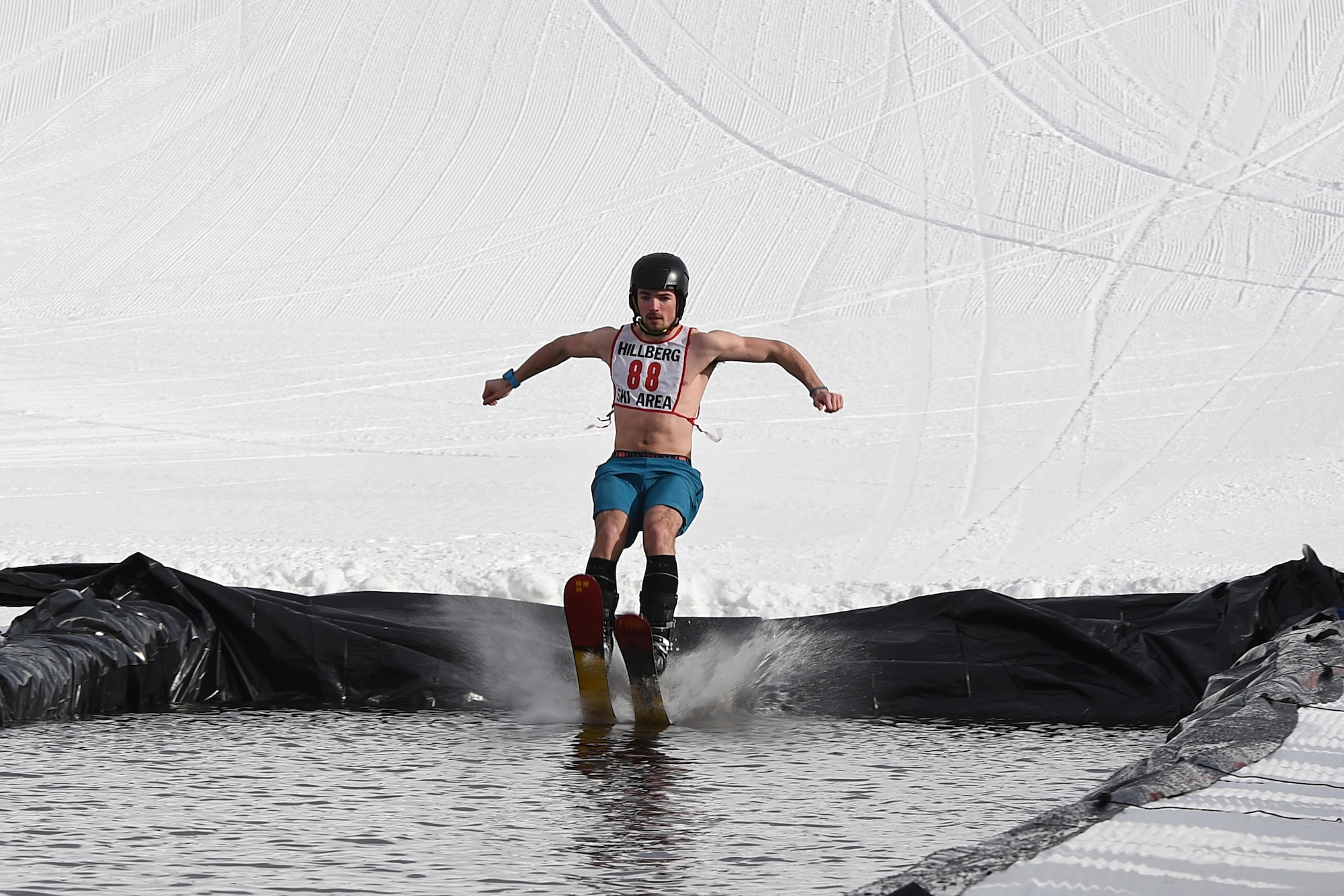 Joint Base Elmendorf-Richardson personnel and families participate in the Slush Cup at the Hillberg Ski Area, March 19, 2017. The Slush Cup is an annual event where skiers and snowboarders try to make it across a slush pond without falling. 