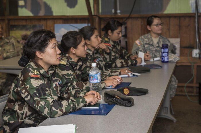 SCHOFIELD BARRACKS, Hawaii – (Feb. 21, 2017) - Nepalese soldiers attend a briefing presented by U.S. soldiers at the 25th Infantry Division’s Lightning Academy at Schofield Barracks on Feb. 21, 2017. The 25th Infantry Division hosted a delegation with female Nepalese Army officers to share information, techniques, tactics and procedures in order to promote the effectiveness and integration of females into combat roles. (Department of Defense photo by Petty Officer 2nd Class Aiyana S. Paschal)