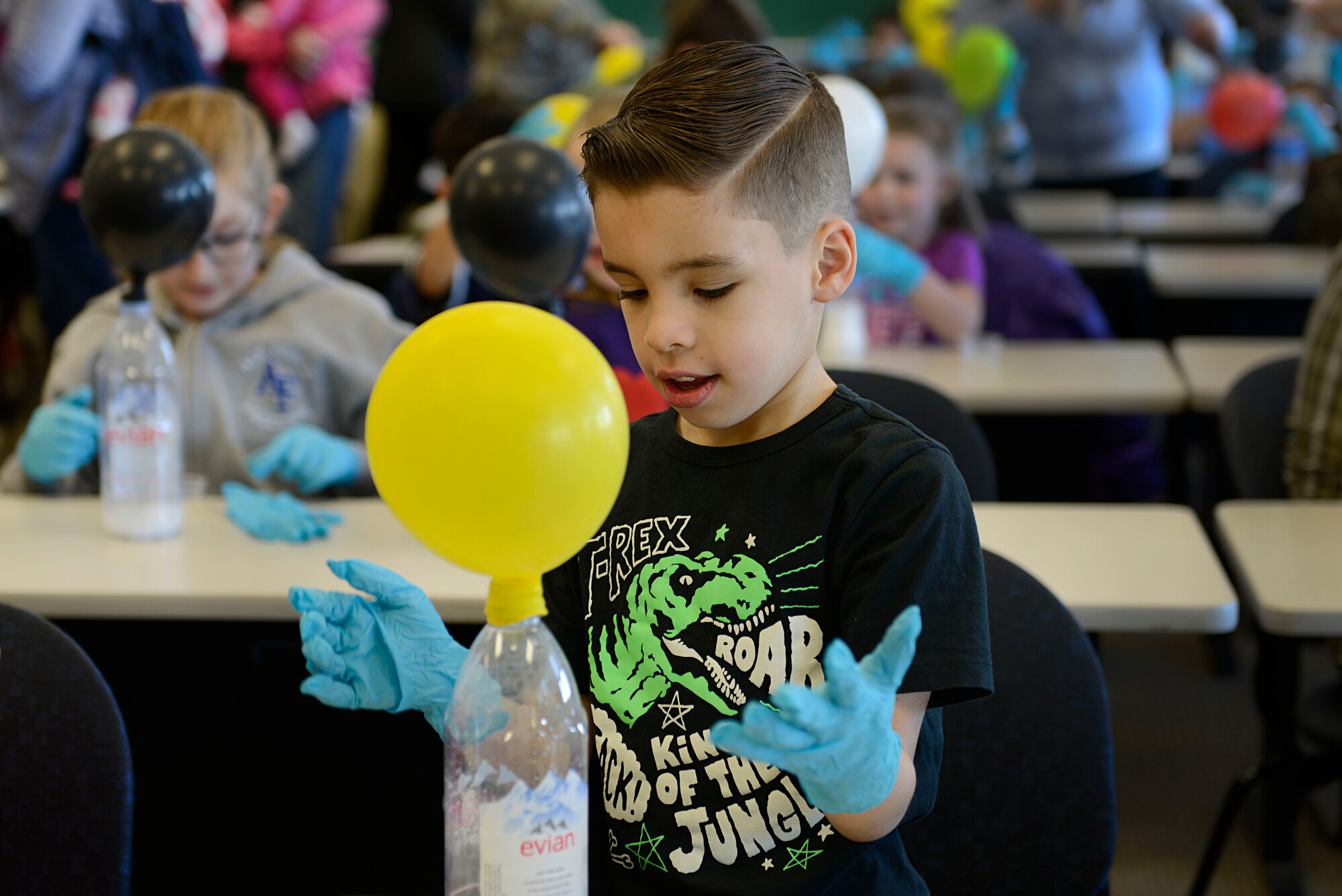 Jacob Valentin, 9, fills a balloon with the gas created from a chemical reaction between vinegar and baking soda during the Spring Break Science Program at the Joint Base Elmendorf-Richardson Library, March 17, 2017. The program offered various interactive experiments and activities revolving around science for children during the week of spring break. 