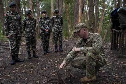 SCHOFIELD BARRACKS, Hawaii - (Feb. 21, 2017) - Nepalese soldiers attend jungle survival training presented by U.S. soldiers at the 25th Infantry Division’s Jungle Operations Training Center. The 25th Infantry Division hosted a delegation with female Nepalese Army officers to share information, techniques, tactics and procedures in order to promote the effectiveness and integration of females into combat roles. (Department of Defense photo by Petty Officer 2nd Class Aiyana S. Paschal)