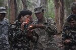 SCHOFIELD BARRACKS, Hawaii - (Feb. 21, 2017) – Maj. Samjhana Shrestha, a Nepalese soldier, participates in jungle survival training with U.S. soldiers at the 25th Infantry Division’s Jungle Operations Training Center. The 25th Infantry Division hosted a delegation with female Nepalese Army officers to share information, techniques, tactics and procedures in order to promote the effectiveness and integration of females into combat roles. (Department of Defense photo by Petty Officer 2nd Class Aiyana S. Paschal)