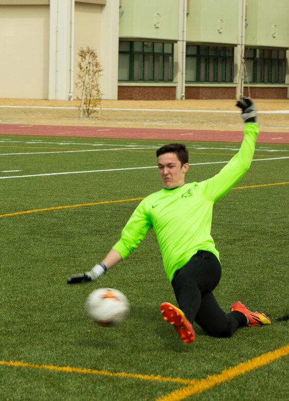 The goalie from Canadian Academy High School blocks a Yokota High School soccer player’s kick into the goal during the Perry Cup Soccer Tournament 2017 at Marine Corps Air Station Iwakuni, Japan, March 18, 2017. The Yokota Panthers won the game 5-0 and second place in the Maroon Group. (U.S. Marine Corps photo by Pfc. Stephen Campbell)