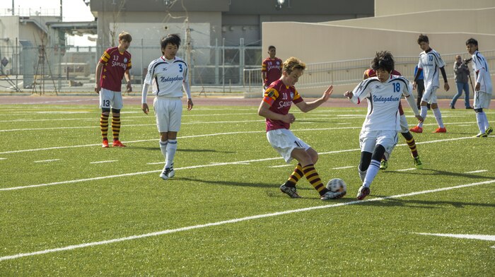 A Matthew C. Perry High School player competes with a Noda Gakuen player over the ball during the Perry Cup Soccer Tournament 2017 at Marine Corps Air Station Iwakuni, Japan, March 18, 2017. The Noda Gakuen soccer team from Yamaguchi City won the match against M.C. Perry 5-2 and first place in the Maroon Group. (U.S. Marine Corps photo by Pfc. Stephen Campbell)
