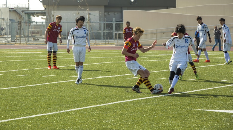 A Matthew C. Perry High School player competes with a Noda Gakuen player over the ball during the Perry Cup Soccer Tournament 2017 at Marine Corps Air Station Iwakuni, Japan, March 18, 2017. The Noda Gakuen soccer team from Yamaguchi City won the match against M.C. Perry 5-2 and first place in the Maroon Group. (U.S. Marine Corps photo by Pfc. Stephen Campbell)