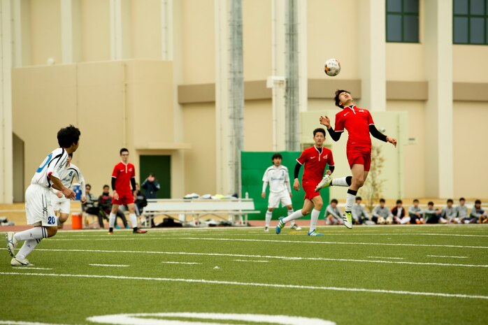 A Canadian Academy soccer player from Kobe head-butts a soccer ball in a game against Noda Gakuen High School from Yamaguchi City during the Perry Cup Soccer Tournament 2017 at Marine Corps Air Station Iwakuni, Japan, March 18, 2017. Noda Gakuen won the game against Canadian Academy 4-3 and first place in the Maroon Group. (U.S. Marine Corps photo by Pfc. Stephen Campbell)