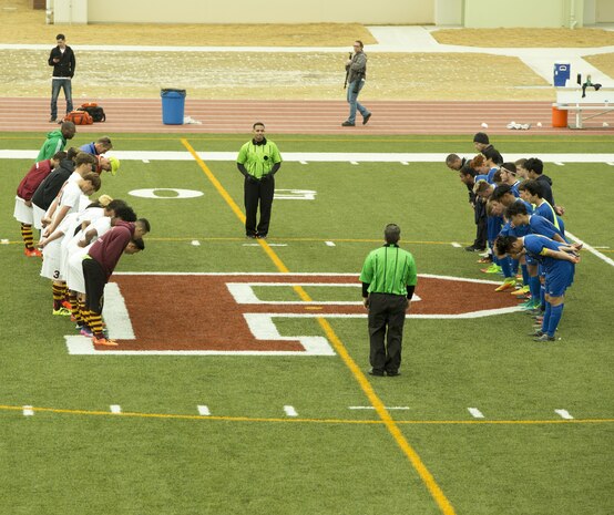 The Matthew C. Perry and Yokota High School soccer teams bow to one another after their match during the Perry Cup Soccer Tournament 2017 at Marine Corps Air Station Iwakuni, Japan, March 18, 2017. This is a formality every team did to one another after each game. (U.S. Marine Corps photo by Pfc. Stephen Campbell)
