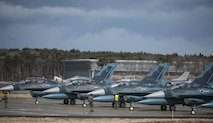 Japan Air Self-Defense Force F-2 Viper Zeros wait on standby as F-16 Fighting Falcons prepare to deploy for a dissimilar air combat-training at Misawa Air Base, Japan, March 17, 2017. The F-16s escorted and cleared the area of enemy ground-to- air missiles and ensured the F-2s were not targeted as they focused on deploying their air-to- ground missiles. (U.S. Air Force photo by Senior Airman Jarrod Vickers)