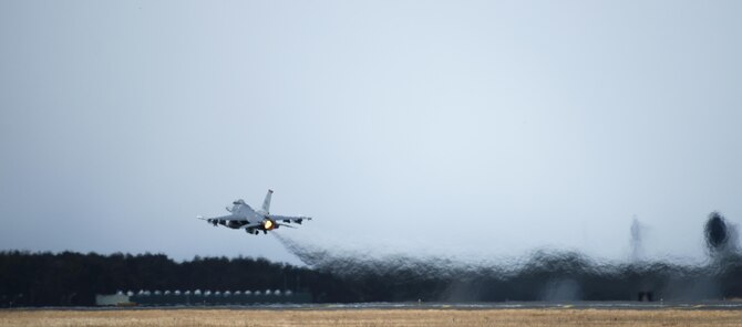 A U.S. Air Force F-16 Fighting Falcon takes off during a dissimilar air combat-training (DAC-T) at Misawa Air Base, Japan, March 17, 2017. The DAC-T is a practice of using various aircraft, while integrating with other national forces, to execute one common goal. (U.S. Air Force photo by Senior Airman Jarrod Vickers)