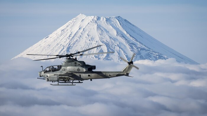 Marine Light Attack Helicopter Squadron 267 AH-1Z Viper and UH-1Y Venom helicopters past Mount Fuji, Shizuoka, Japan, March 12, 2017. The squadron, currently supporting Marine Aircraft Group 36, 1st Marine Aircraft Wing, III Marine Expeditionary Force through the unit deployment program, validated the long-range capability of auxiliary fuel tanks on their H-1 platform helicopters by flying 314 nautical miles during one leg of the four-day mission, March 10.