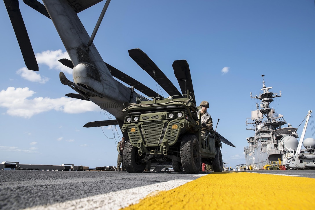 Marine Corps Cpl. Nathan Banta drives a vehicle on the flight deck of the USS Bonhomme Richard to support amphibious integration training in the Philippine Sea, March 15, 2017. The training integrates all elements of the Bonhomme Richard Expeditionary Strike Group and 31st Marine Expeditionary Unit to test their abilities to execute tasks. The Bonhomme Richard is operating in the Indo-Asia-Pacific region to enhance warfighting readiness. Navy photo by Seaman Apprentice Jesse Marquez Magallanes
