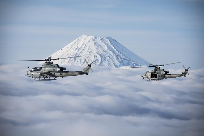 Marine Light Attack Helicopter Squadron 267 AH-1Z Viper and UH-1Y Venom helicopters past Mount Fuji, Shizuoka, Japan, March 12, 2017. The squadron, currently supporting Marine Aircraft Group 36, 1st Marine Aircraft Wing, III Marine Expeditionary Force through the unit deployment program, validated the long-range capability of auxiliary fuel tanks on their H-1 platform helicopters by flying 314 nautical miles during one leg of the four-day mission, March 10. These aircrafts’ extended range is crucial to maintaining a stronger, more capable forward-deployed force in readiness in the Indo-Asia-Pacific region. The squadron is based out of Camp Pendleton, California. (U.S. Marine Corps photo by Lance Cpl. Andy Martinez)