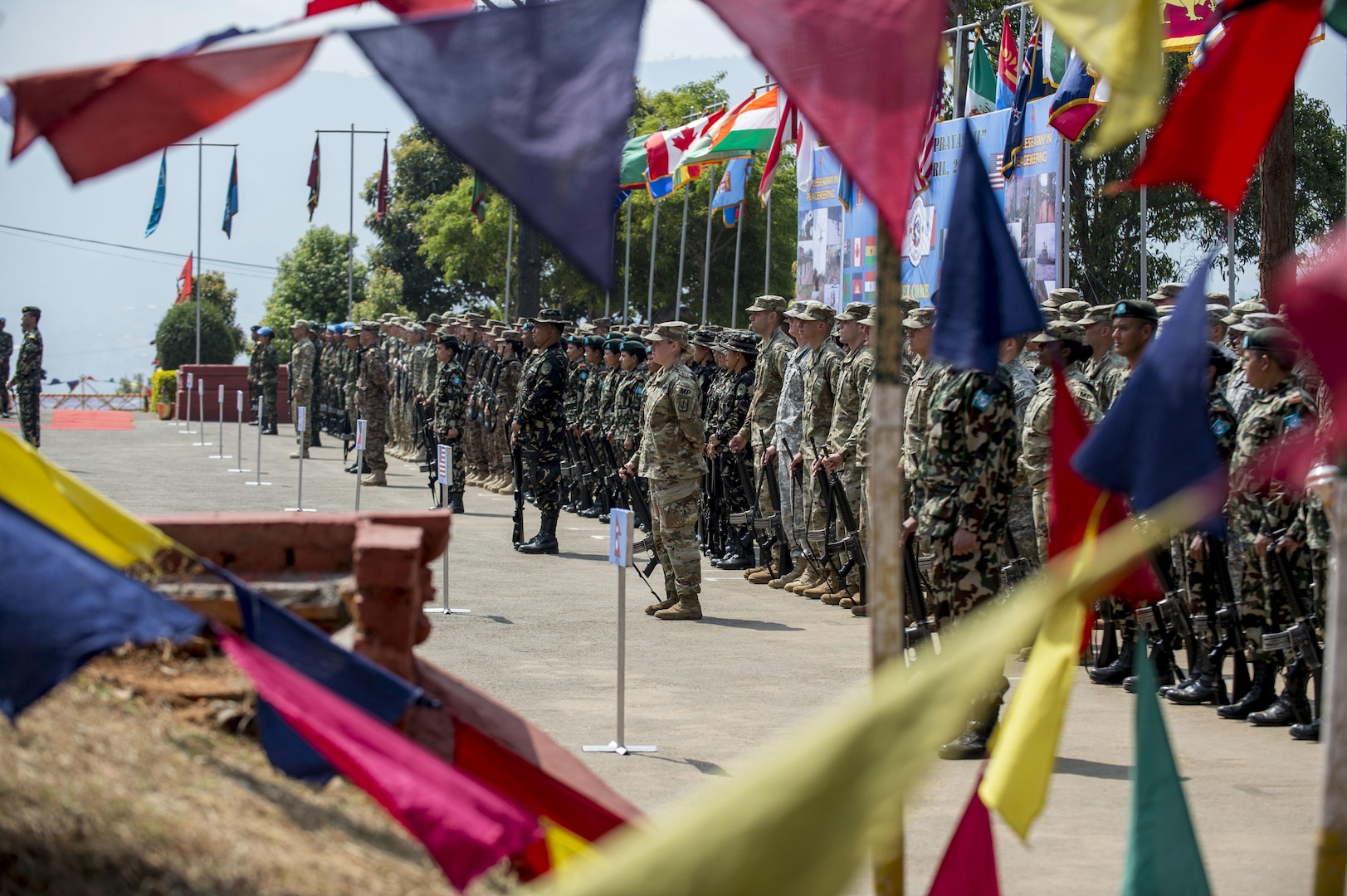 Militaries from more than 30 countries stand in formation during the opening ceremony of Shanti Prayas III in Nepal. Shanti Prayas III is a multinational United Nations peacekeeping exercise designed to provide pre-deployment training to U.N. partner countries in preparation for real-world peacekeeping operations. (U.S. Navy Photo by Petty Officer 2nd Class Taylor Mohr)