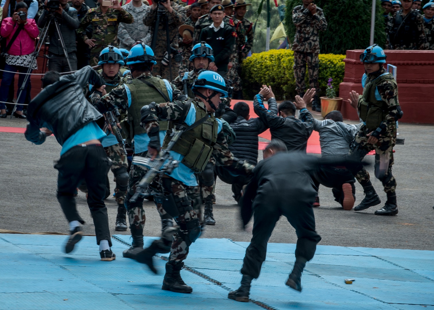 Nepalese peacekeepers give a hand-to-hand self-defense demonstration during the opening ceremony of exercise Shanti Prayas III in Nepal. Shanti Prayas III is a multinational United Nations peacekeeping exercise designed to provide pre-deployment training to U.N. partner countries in preparation for real-world peacekeeping operations. (U.S. Navy Photo by Petty Officer 2nd Class Taylor Mohr)