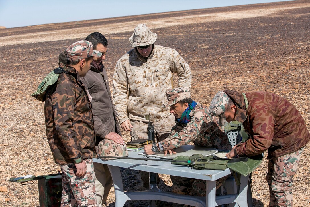 U.S. Marine Cpl. Cameron Joseph, a forward observer with 4th Air/Naval Gunfire Liaison Company Detachment, Special Purpose Marine Air-Ground Task Force – Crisis Response – Central Command, trains alongside a Jordanian mortar team with the Jordanian Quick Reaction Force during a close air support live fire exercise in Jordan, Feb. 19, 2017. The U.S. Marines train alongside Jordanian, and other coalition partners, to enhance each other’s skills and knowledge in support of mutual objectives while meeting common security challenges. (U.S. Marine Corps photo by Lance Cpl. Kyle McNan) 