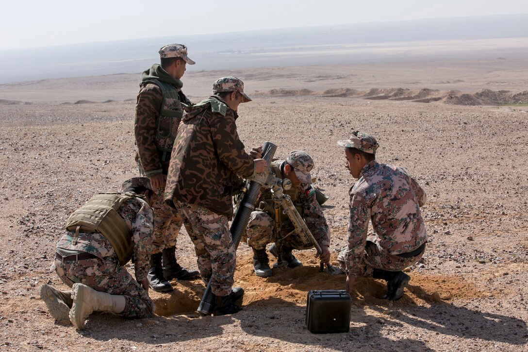 A Jordanian Army mortar team with the Jordanian Quick Reaction Force sets up an 82mm mortar tube in support of a joint terminal attack controller exercise while in Jordan, Feb. 20, 2017. Jordanian forward observers and JTACs work together during this exercise to maintain proficiency in key skills. The U.S. Marines train alongside the Jordanians and other coalition partners to enhance each other’s skills and knowledge in support of mutual objectives while meeting common security challenges (U.S. Marine Corps photo by Lance Cpl. Kyle McNan) 