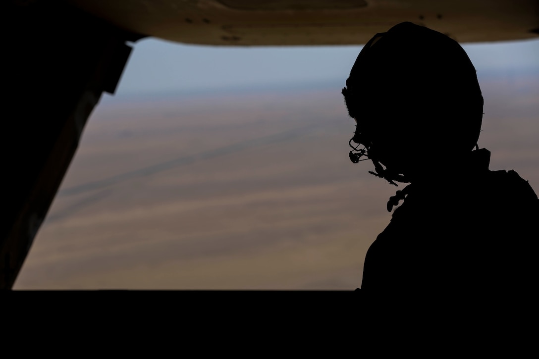 Sgt. Chad Burpee, a crew chief with Marine Medium Tiltrotor Squadron 165, Special Purpose Marine Air-Ground Task Force-Crisis Response-Central Command, stands in the back of an MV-22B Osprey tiltrotor aircraft during an air delivery training exercise while forward deployed in the Middle East, March 9, 2017. The training served as an opportunity for the VMM-165 aircrew to increase their proficiency in aerial cargo delivery. SPMAGTF-CR-CC is a well-trained crisis response unit that has the ability to project combat power over vast distances using organic aviation, logistical and ground combat assets. (U.S. Marine Corps photo by Lance Cpl. Shellie Hall) 