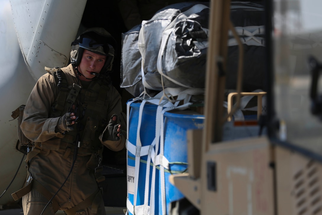 Sgt. Chad Burpee, a crew chief with Marine Medium Tiltrotor Squadron 165, Special Purpose Marine Air-Ground Task Force-Crisis Response-Central Command, guides cargo onto an MV-22B Osprey tiltrotor aircraft during an air delivery training exercise while forward deployed in the Middle East, March 9, 2017. The training served as an opportunity for the VMM-165 aircrew to increase their proficiency in aerial cargo delivery. SPMAGTF-CR-CC is a well-trained crisis response unit that has the ability to project combat power over vast distances using organic aviation, logistical and ground combat assets. (U.S. Marine Corps photo by Lance Cpl. Shellie Hall) 