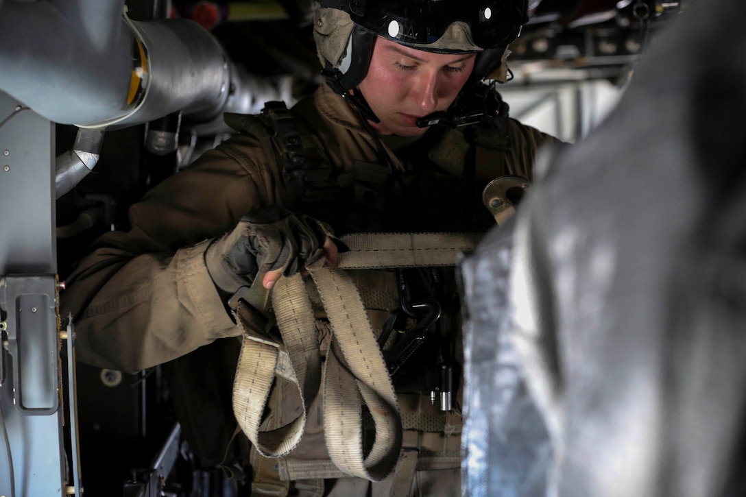 Sgt. Chad Burpee, a crew chief with Marine Medium Tiltrotor Squadron 165, Special Purpose Marine Air-Ground Task Force-Crisis Response-Central Command, secures cargo in an MV-22B Osprey tiltrotor aircraft before take-off during an air delivery training exercise while forward deployed in the Middle East, March 9, 2017. The training served as an opportunity for the VMM-165 aircrew to increase their proficiency in aerial cargo delivery. SPMAGTF-CR-CC is a well-trained crisis response unit that has the ability to project combat power over vast distances using organic aviation, logistical and ground combat assets. (U.S. Marine Corps photo by Lance Cpl. Shellie Hall)