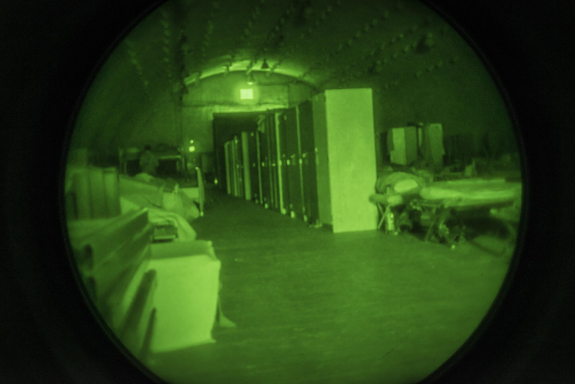 The lights remain off 24/7 in the tents and K-spans in the Rush Park life support area where personnel deployed in support of Key Resolve 2017 at Osan Air Base, Republic of Korea, March 15, 2017. The K-span, which is a pre-manufactured steel-framed building, can house up to 120 personnel who sleep on both beds and cots and most have wall lockers to secure their valuables. The only lights visible are flash lights and daylight which creeps through the various cracks in the building’s superstructure. Overhead lights permanently stay off for members who work different shifts during the 24/7 operations of KR17. (U.S. Air Force photo by Staff Sgt. Benjamin W. Stratton)