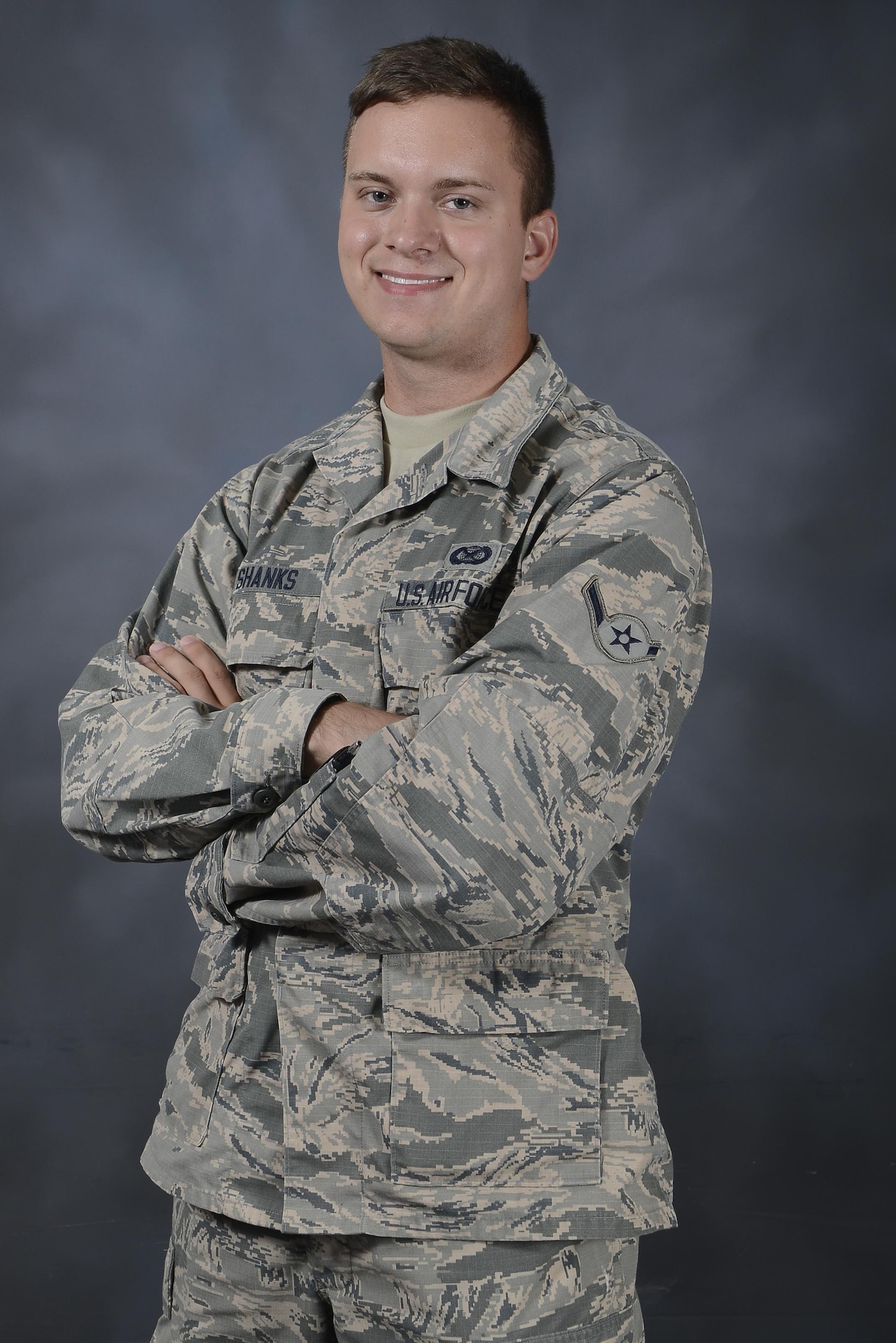 Airman Adam Shanks, a photojournalist with the 6th Air Mobility Wing, pause for a photo at MacDill Air Force Base, Fla., Aug. 22, 2016. Shanks joined the Air Force to see new places and meet new people. (U.S. Air Force photo by Airman 1st Class Mariette Adams)