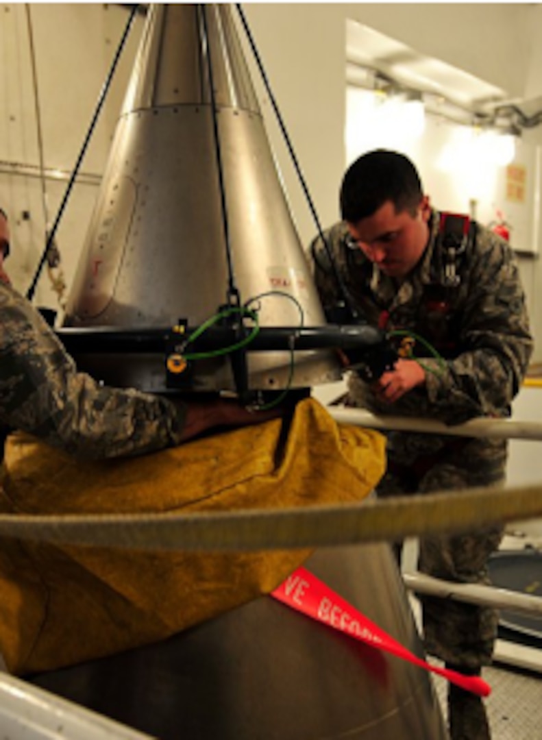 U.S. Air Force Staff Sergeant Wesley Baptiste and Airman Daniel Peryer perform a “simulated missile reduction” in accordance with the New Strategic Arms Reduction Treaty at Minot Air Force Base, North Dakota, November 29, 2011.