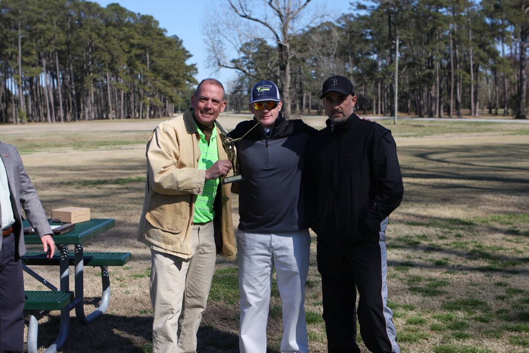 On March 17, 2017 MCES sponsored an Engineer Golf Tournament at the Paradise Point Golf Club to build camaraderie within the engineer community, family, and friends. First Sergeant Brendan Slattery holds the trophy for Second Place.  Also pictured are Master Sergeant Smith and Chief Warrant Officer 4 (ret) Tim Davis.
