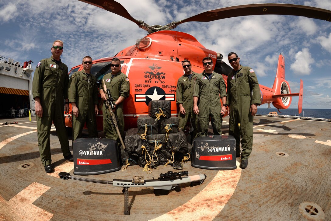 The aircrew of the Florida-based Coast Guard Helicopter Interdiction Tactical Squadron stand for a photo after the 500th recorded drug bust in the Eastern Pacific Ocean, March 11, 2017. U.S. Coast Guard photo.
