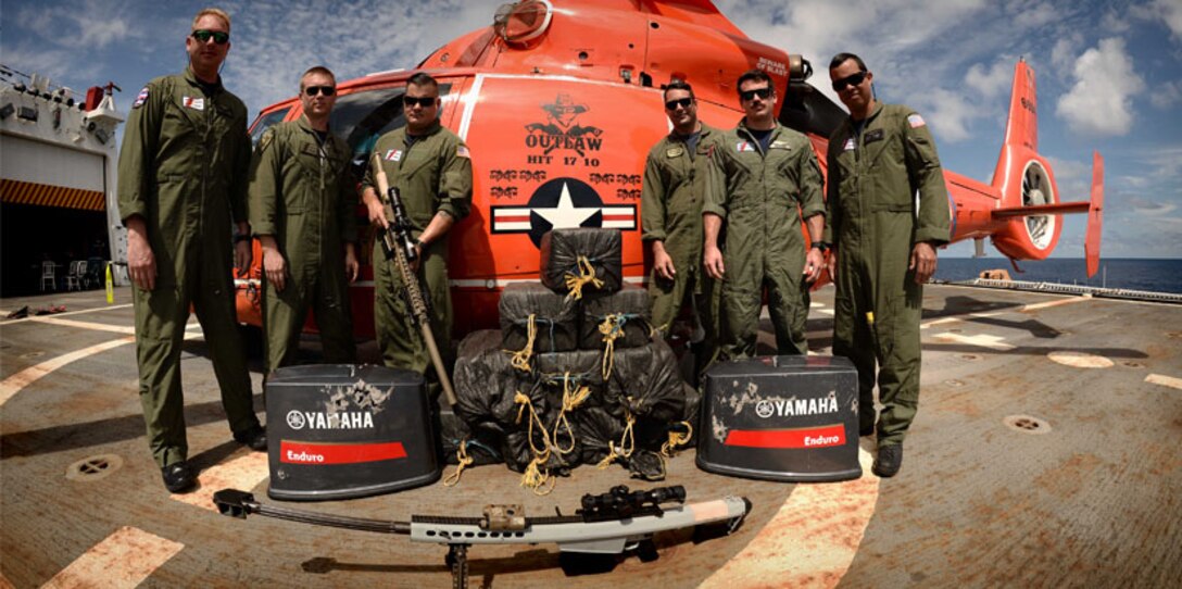 The aircrew of the Florida-based Coast Guard Helicopter Interdiction Tactical Squadron stand for a photo after the 500th recorded drug bust in the Eastern Pacific Ocean, March 11, 2017. U.S. Coast Guard photo.
