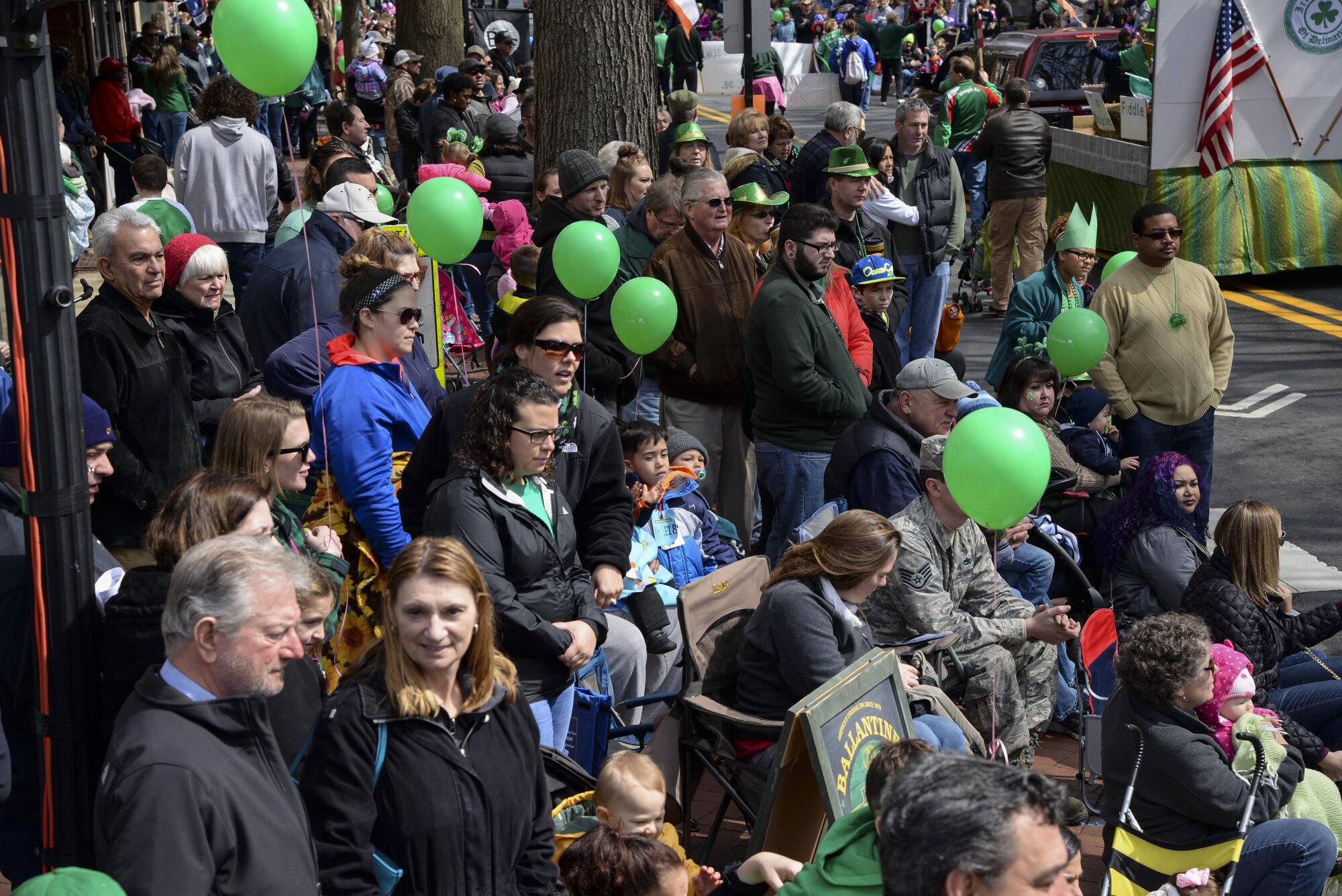 Observers watch the St. Patrick’s Day Parade March 18, 2017, in Downtown Dover, Del. People lined both sides of a main street for several blocks to watch the annual parade. (U.S. Air Force photo by Senior Airman Aaron J. Jenne)