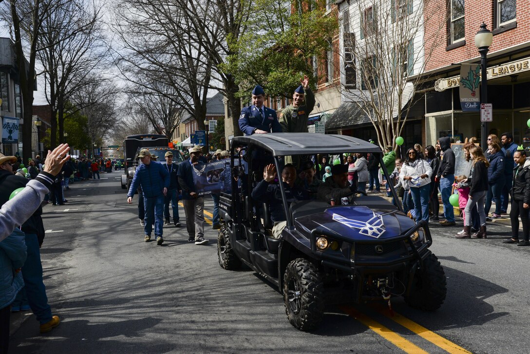 Members of the Air Force recruiting team wave to community members during the St. Patrick’s Day Parade March 18, 2017, in Downtown Dover, Del. Several Air Force active duty and reserve members participated in the parade and helped organize the participants. (U.S. Air Force photo by Senior Airman Aaron J. Jenne)