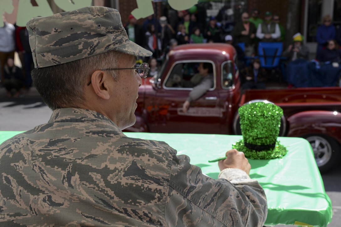 Col. Randy Boswell, 436th Mission Support Group commander, grades a classic car club during the St. Patrick’s Day Parade March 18, 2017, in Downtown Dover, Del. More than five thousand people gathered to celebrate the holiday. (U.S. Air Force photo by Senior Airman Aaron J. Jenne)