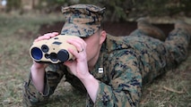 Capt. Patrick Owens, a capabilities integration officer at Marine Corps Combat Development and Integration, demonstrates the Common Laser Range Finder-Integrated Capability system used by dismounted Marines to deliver accurate distance and location of targets through built-in laser range technology. The lightweight, handheld GPS device was fielded in February and replaces the larger, multi-item legacy. Now with just one system, Marines can relay accurate coordinates for lethal, on target fire support. (U.S. Marine Corps photo by Mathuel Browne)