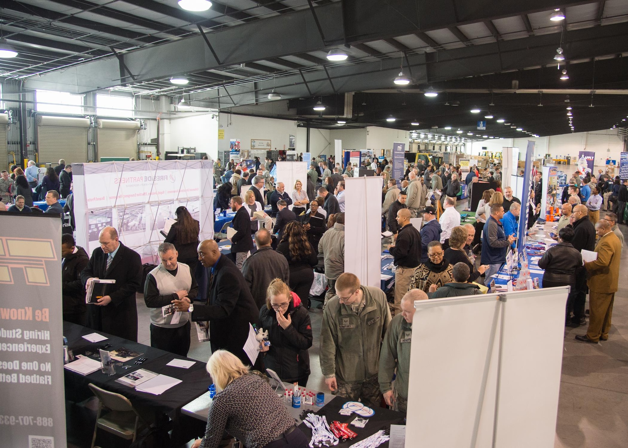 Members of Team Dover attend a job fair during the Transition Summit March 16, 2017, at Dover Air Force Base, Del. More than 125 employers and service organizations came to Dover looking to hire transitioning service members, veterans and military spouses. (U.S. Air Force photo by Mauricio Campino)