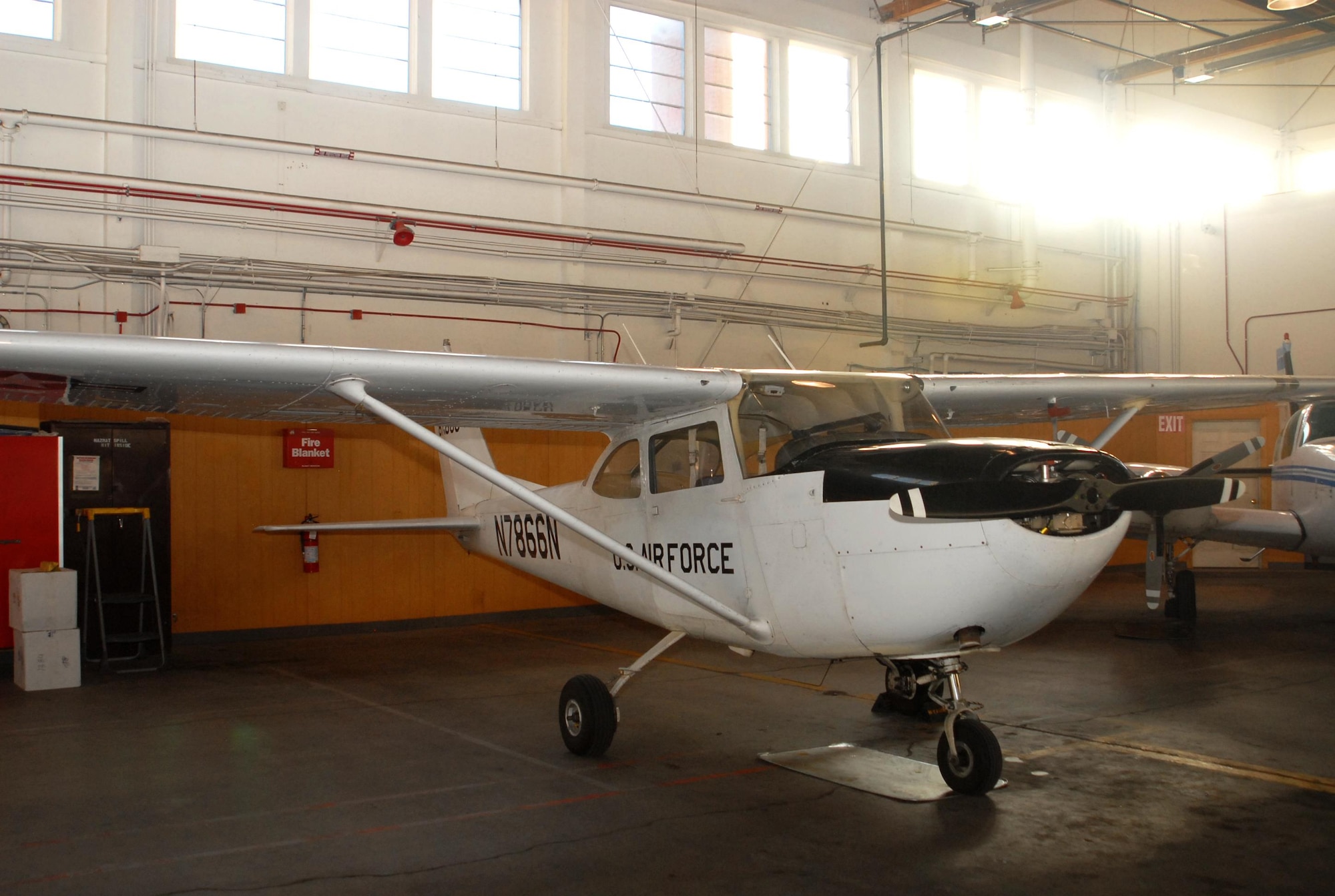 The 1967 Cessna R172E aircraft is parked in Hangar 133 at Peterson Air Force Base, Colorado, March 20, 2017. This aircraft is one of seven aircraft the Rocky Mountain USAF Flight Training Center currently operational after the July 2016 hail storm that heavily damaged numerous aircraft. 