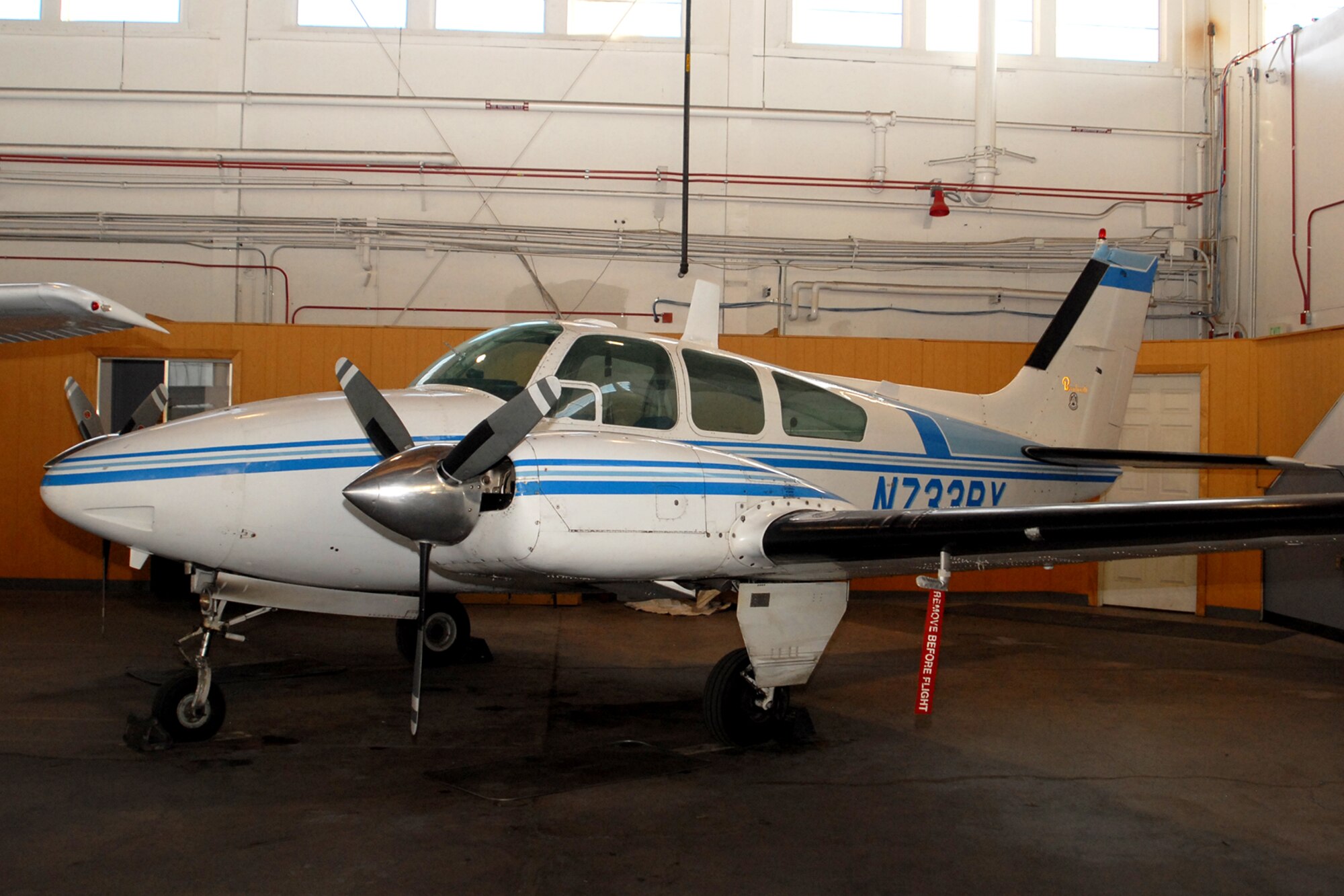 The 1965 Beech 95-B55 aircraft sits in a corner of Hangar 133 at Peterson Air Force Base, Colorado, March 20, 2017. This aircraft along with six others are part of the Rocky Mountain USAF Flight Training Center, which teaches people affiliated with the Department of Defense how to fly.