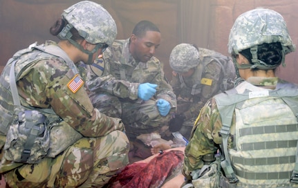 Pvt. Alyssa Swanson (left), Staff Sgt. Melvin Walker (center) and Pvt. Sadie Gowan (right) train at the Combat Trauma Patient Simulation Lab, located at the Medical Education Training Campus at Joint Base San Antonio-Fort Sam Houston.
