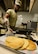 U.S. Air Force Airman 1st Class DeSean Gunter, 100th Communications Squadron client systems technician, prepares pancakes in the base chapel March 21, 2017, on RAF Mildenhall, England. Volunteers and members of the Airmen Committed to Excellence council joined together to make breakfast for junior enlisted personnel across base. (U.S. Air Force photo by Staff Sgt. Micaiah Anthony)