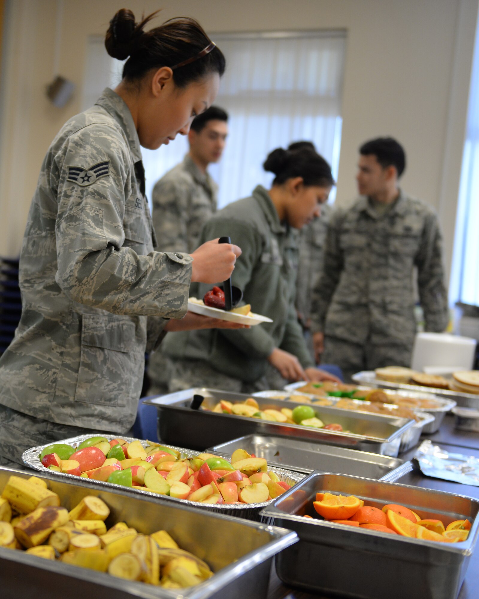 U.S. Air Force Airmen prepare their plates at the base chapel March 21, 2017, on RAF Mildenhall, England. The Airmen Committed to Excellence council hosted a free breakfast for Team Mildenhall’s Airmen. The ACE council enables Airmen the opportunity to give back to military and local communities through community service. (U.S. Air Force photo by Staff Sgt. Micaiah Anthony)