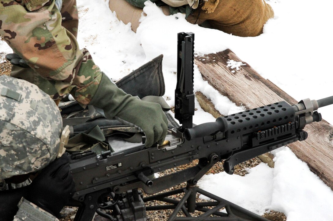 An Army reservist loads an M240B machine gun for zero and qualification during Operation Cold Steel at Fort McCoy, Wis., March 13, 2017. Operation Cold Steel is the Army Reserve's crew-served weapons qualification and validation exercise to ensure that units and soldiers are trained and ready to deploy on short-notice. Army Reserve photo by Staff Sgt. Debralee Best