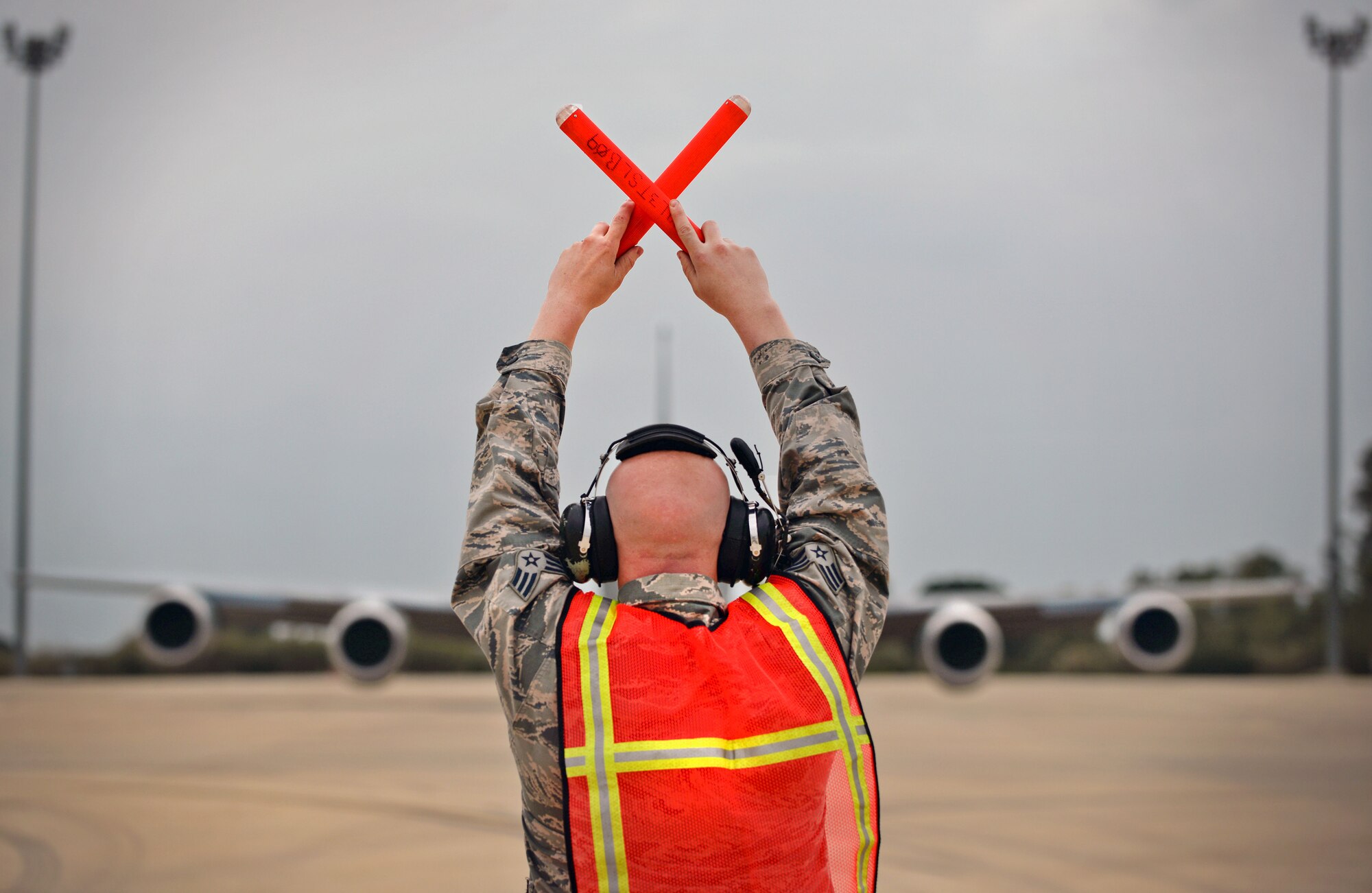 U.S. Air Force Senior Airman Keiven Polm, 100th Aircraft Maintenance Squadron KC-135 Stratotanker crew chief, marshals a KC-135 Stratotanker off the flightline March 16, 2017, at Naval Station Rota, Spain. The 100th ARW Airmen are currently providing air refueling support for French Forces combat operations in Mali and North Africa. (U.S. Air Force photo by Senior Airman Christine Halan) 